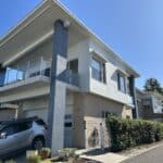 New extrior paint for a house in Dudley on a leafy street.